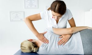 A health care professional applying treatment to a patient