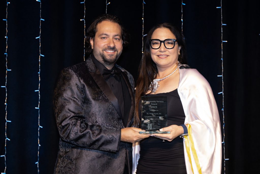Community Service Award winner, Dr. Peter Fonti (left) and OCA Board member, Dr. Patricia Tavares (right)
