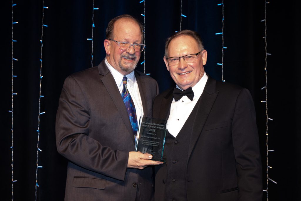 Dr. Michael Brickman Heart and Hands Award winner, Dr. Vincent Sinclair (right) and OCA Board member, Dr. Reginald Gates (left)