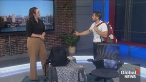 A chiropractor speaking with a news anchor in a studio.