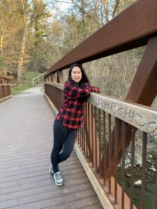 Dr. Oishi standing on a bridge