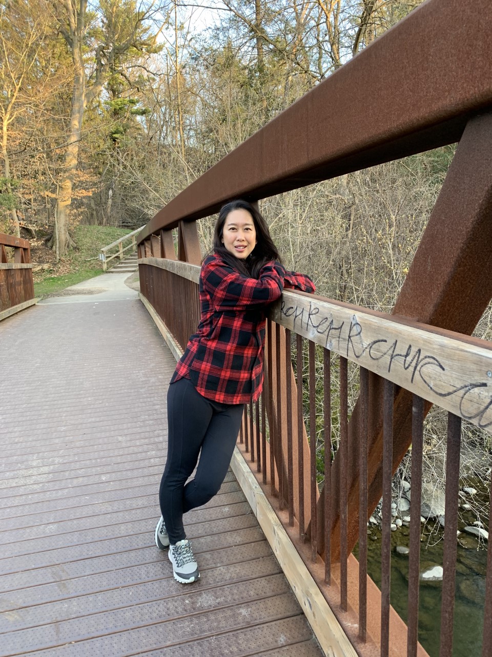 Dr. Oishi standing on a bridge