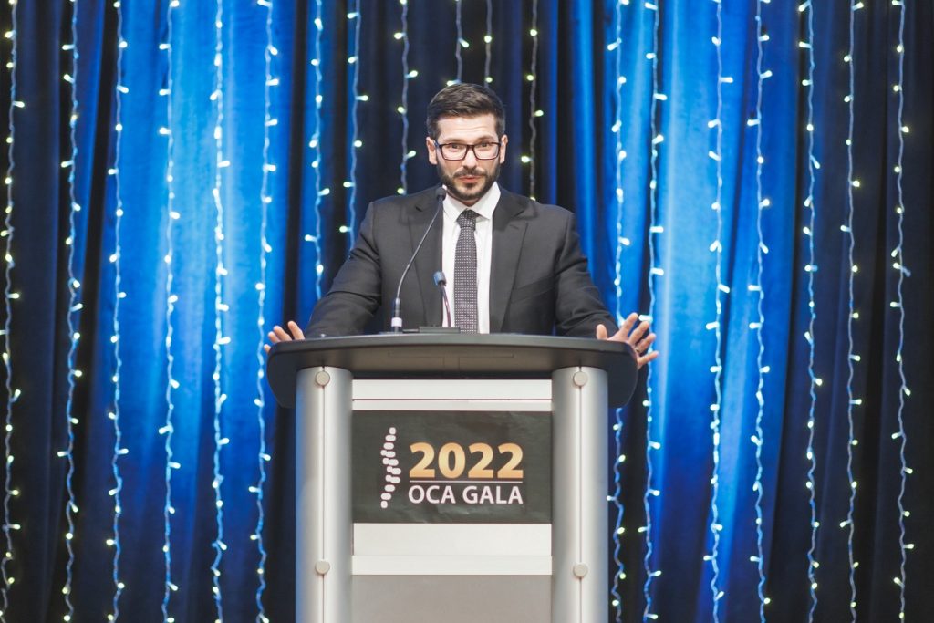 Dr. Demetry Assimakopoulos at podium