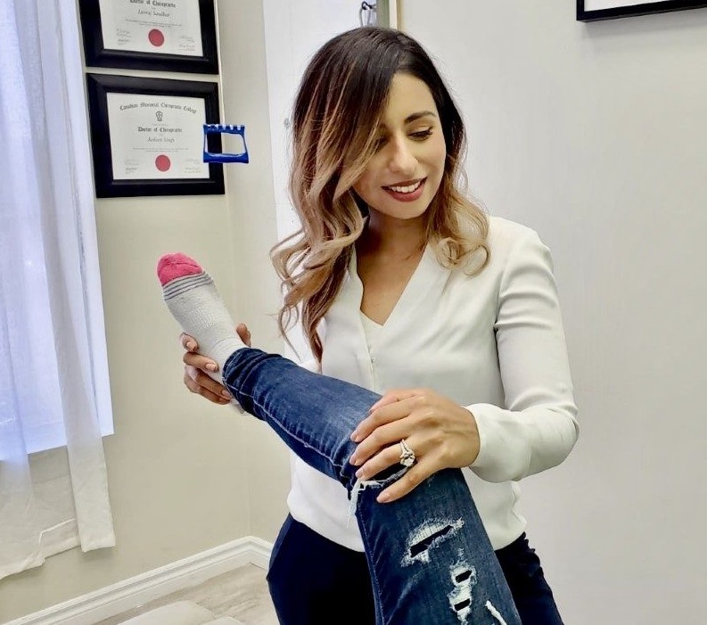 Dr. Jasleen Singh working with patient Dr. Jasleen Singh working with patient