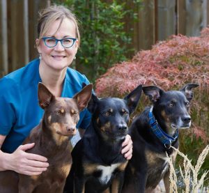 Dr. Kim Adie posed with her three dogs