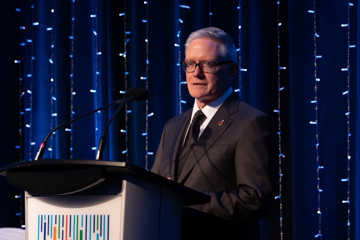 Dr. Tony Tibbles, 2023 Chiropractor of the Year Award winner, at podium