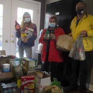 Dr. Amber Gardiner, Grimsby Chiropractor, with donated food items