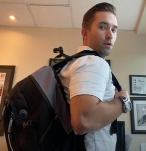 Man showing backpack safety