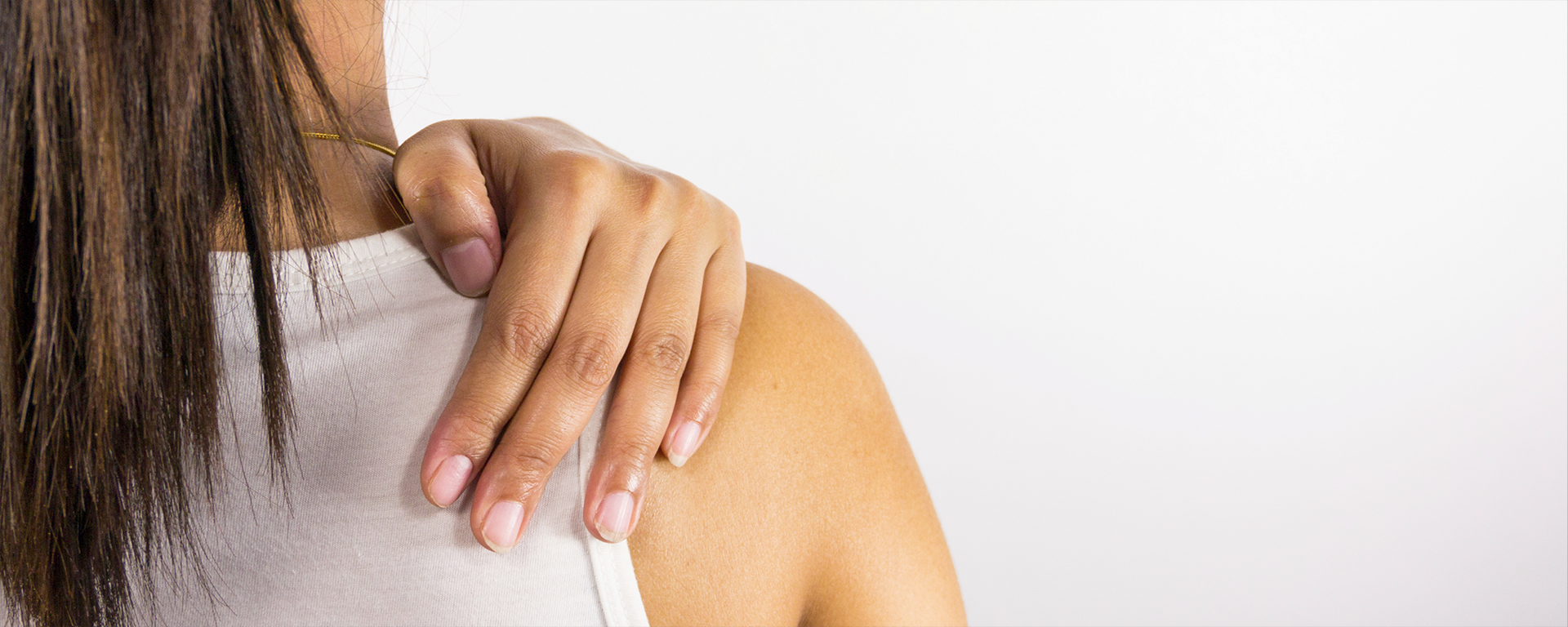 Back of woman with hand on shoulder