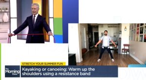 Dr. Gray demonstrates a stretch with morning show host