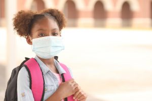 Young girl wearing a backpack