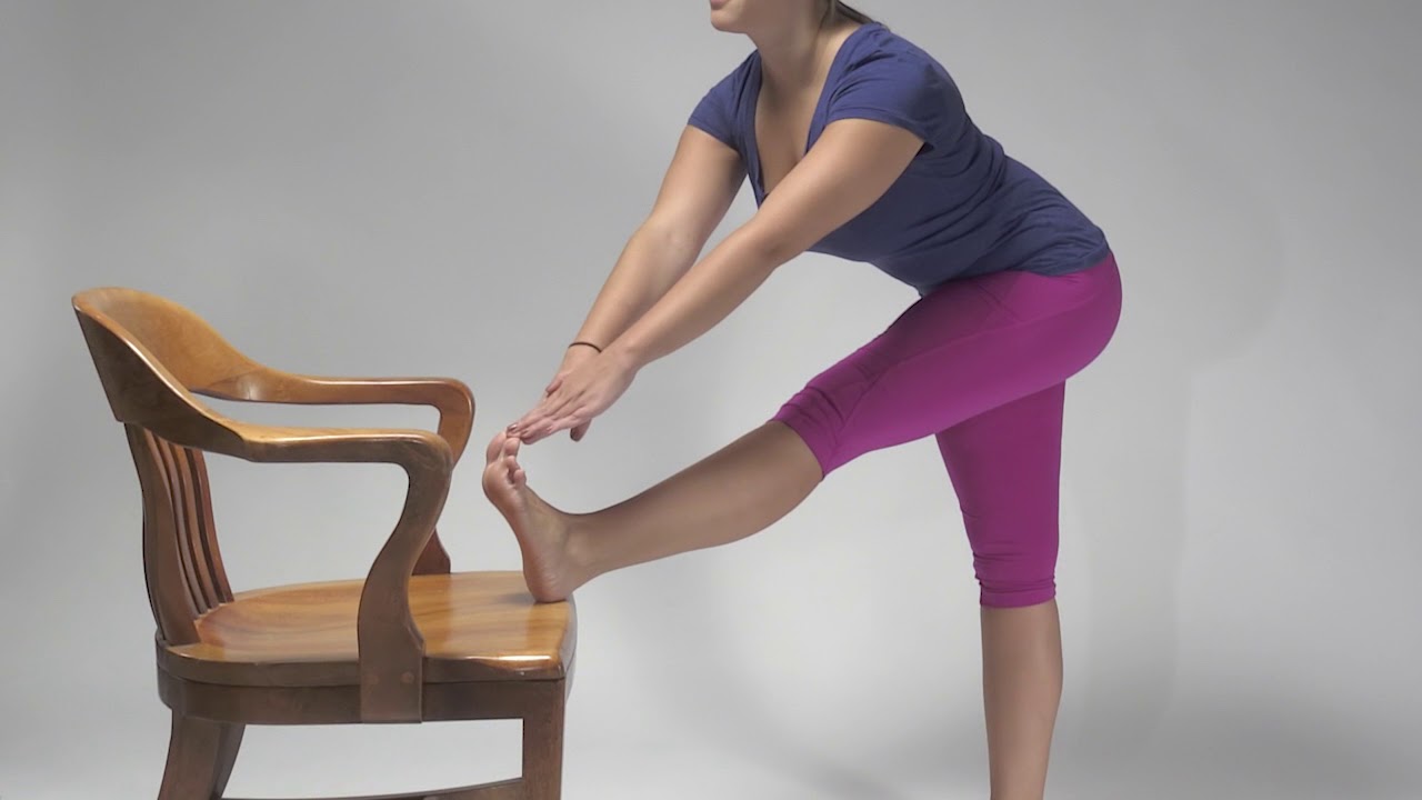Hamstring stretch demo using chair