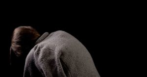 A woman with a hunchback