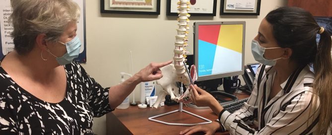 Dr. Aksa Ahmed working with a patient