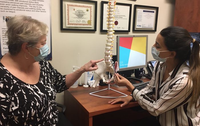 Dr. Aksa Ahmed working with a patient