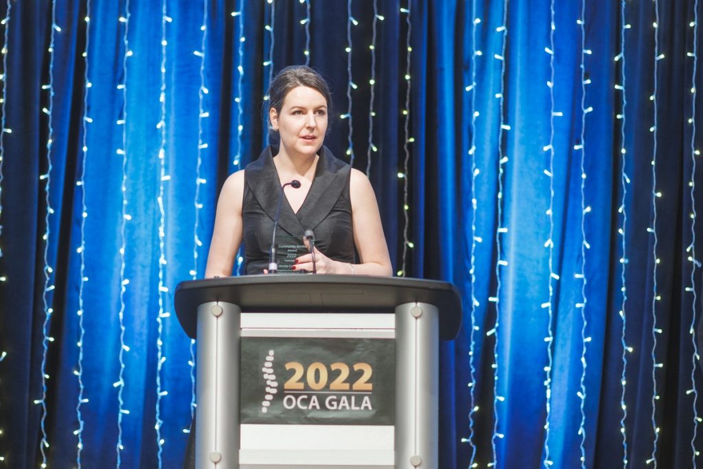 Dr. Michele Corriveau at podium