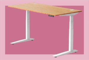 An image of a desk with a pink background.